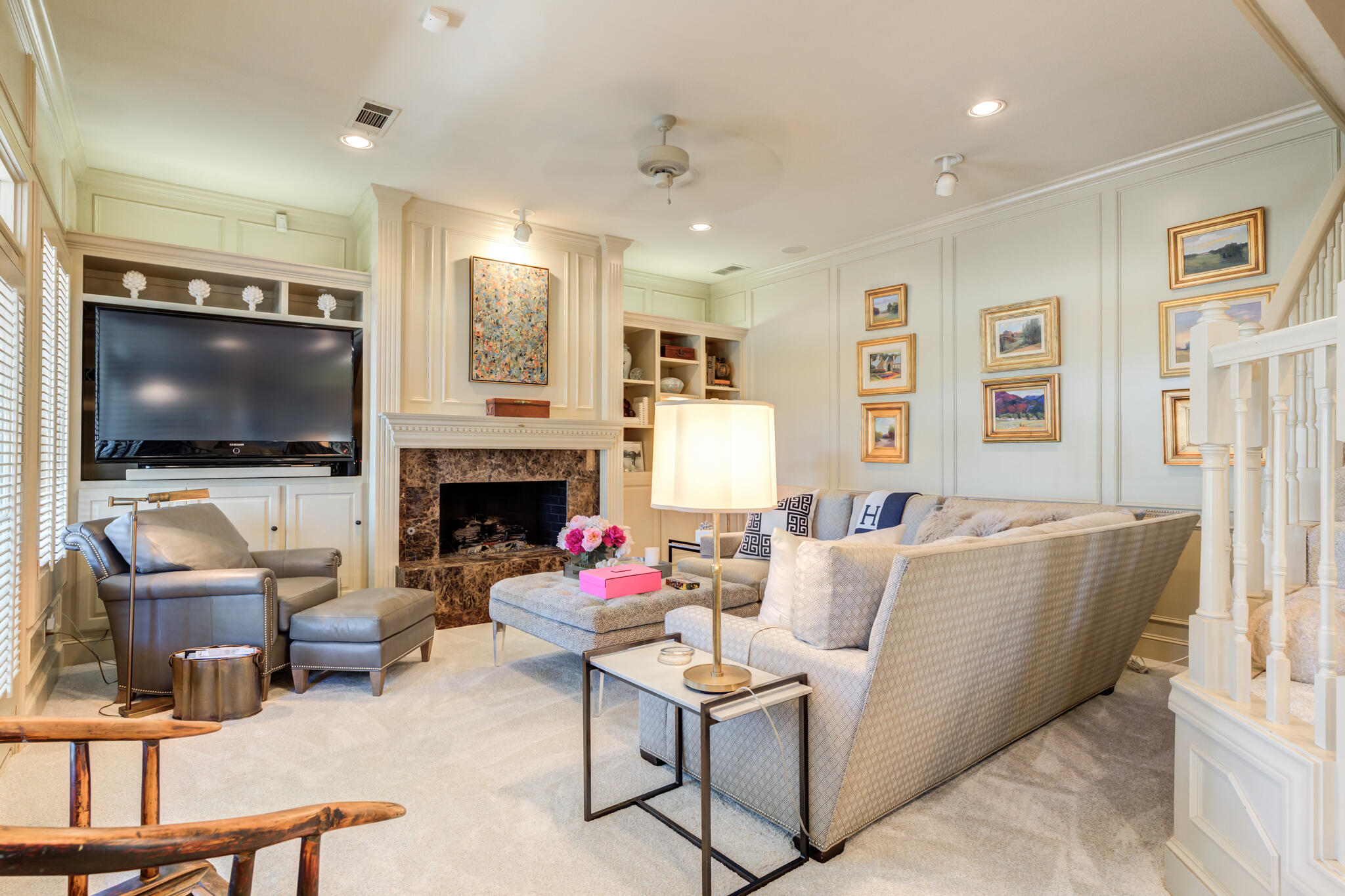 4612 91st Street Lubbock, TX 79424 - Photo 55 of 83 a living room with furniture a flat screen tv and a fireplace
