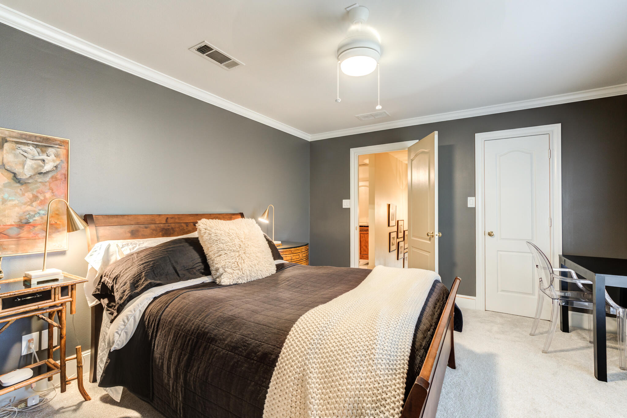 4612 91st Street Lubbock, TX 79424 - Photo 68 of 83 a bedroom with a bed and a desk