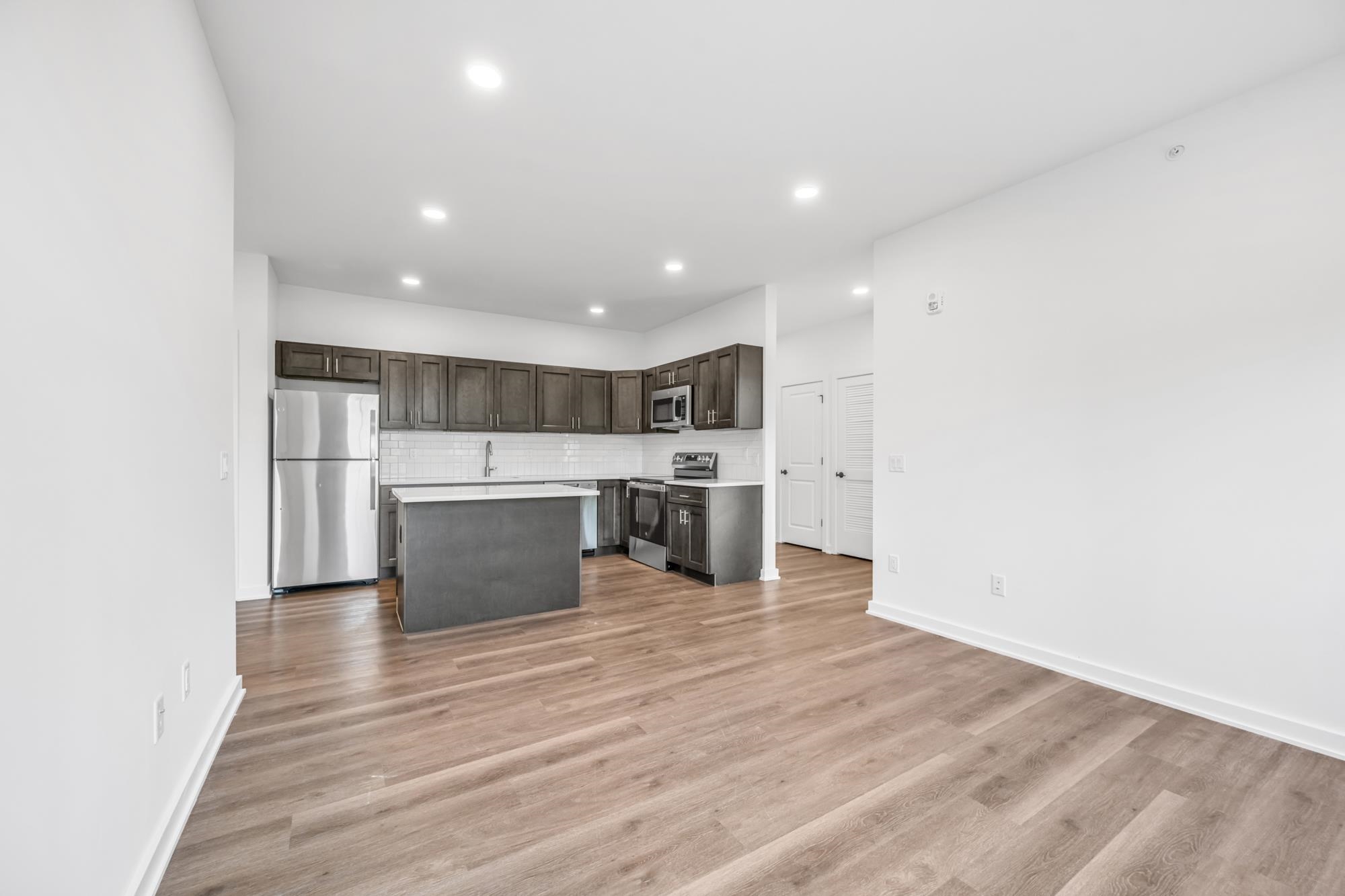 a view of kitchen with wooden floor