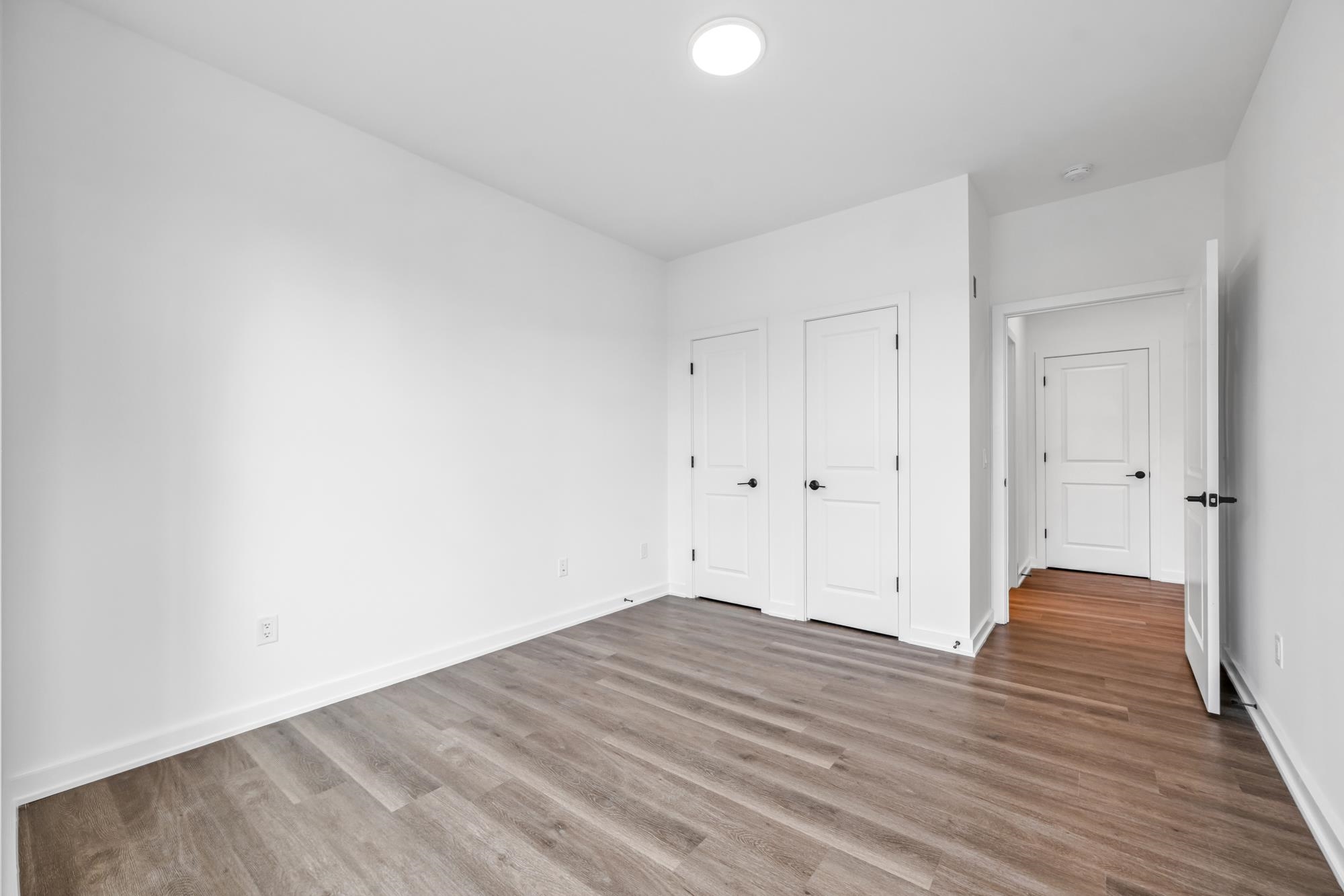 315 Railroad Avenue, Unit 204 East Rutherford, NJ 07073 - Photo 17 of 29 a view of room with wooden floor