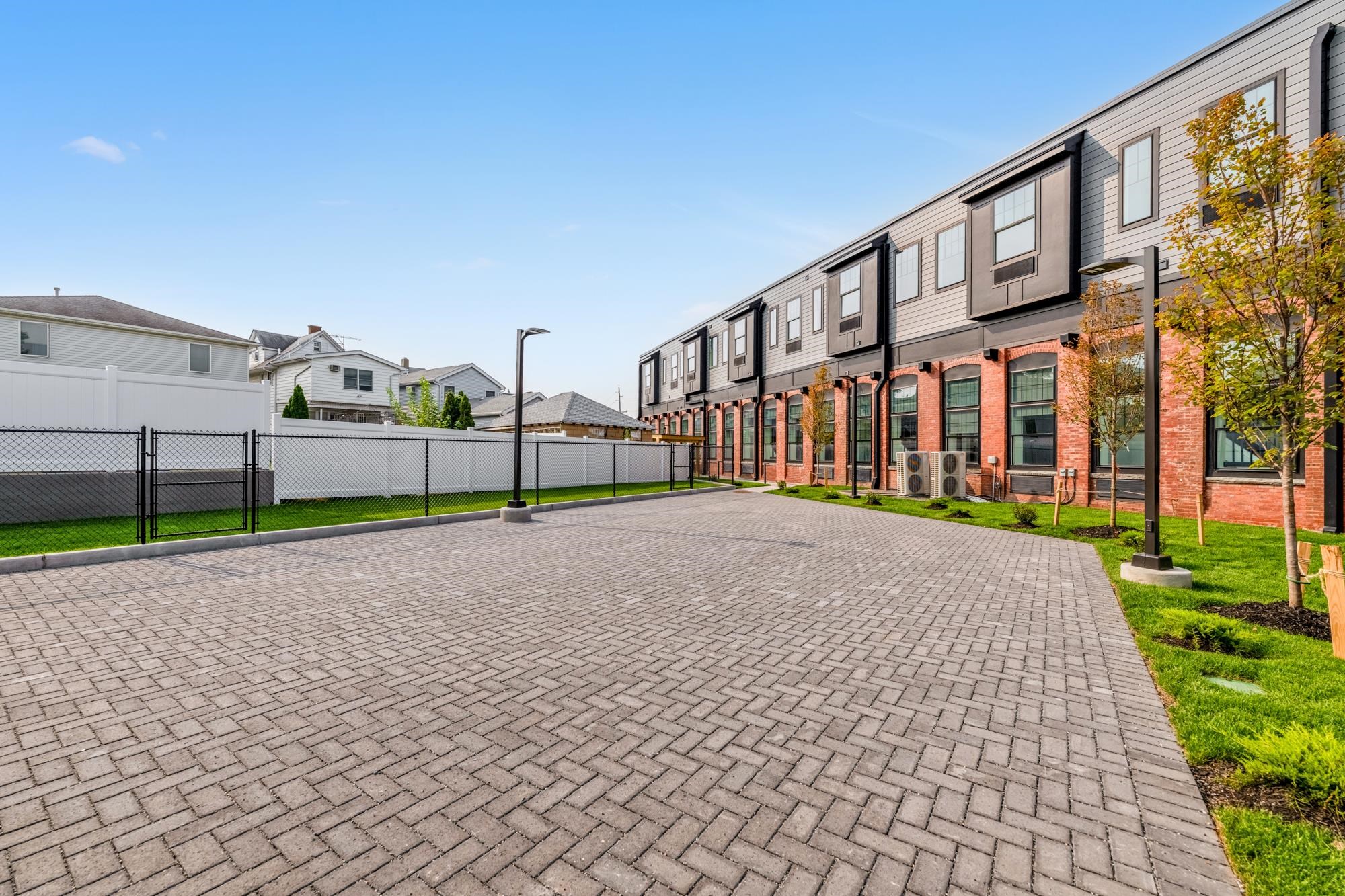 315 Railroad Avenue, Unit 204 East Rutherford, NJ 07073 - Photo 23 of 29 a view of a house with a yard