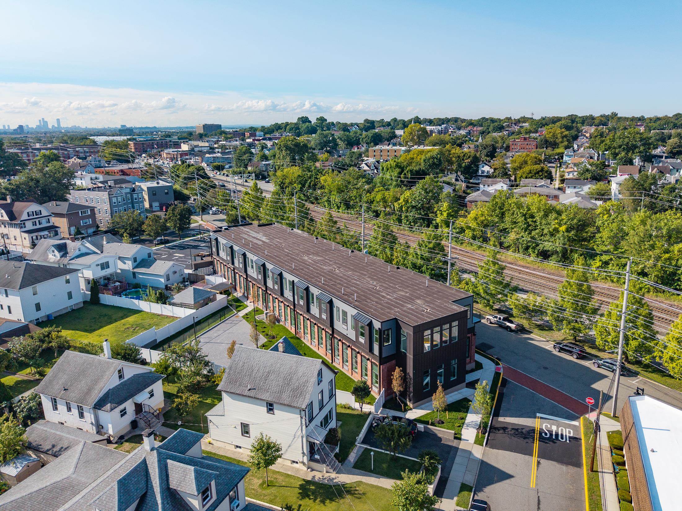 315 Railroad Avenue, Unit 204 East Rutherford, NJ 07073 - Photo 27 of 29 an aerial view of residential houses with outdoor space and swimming pool