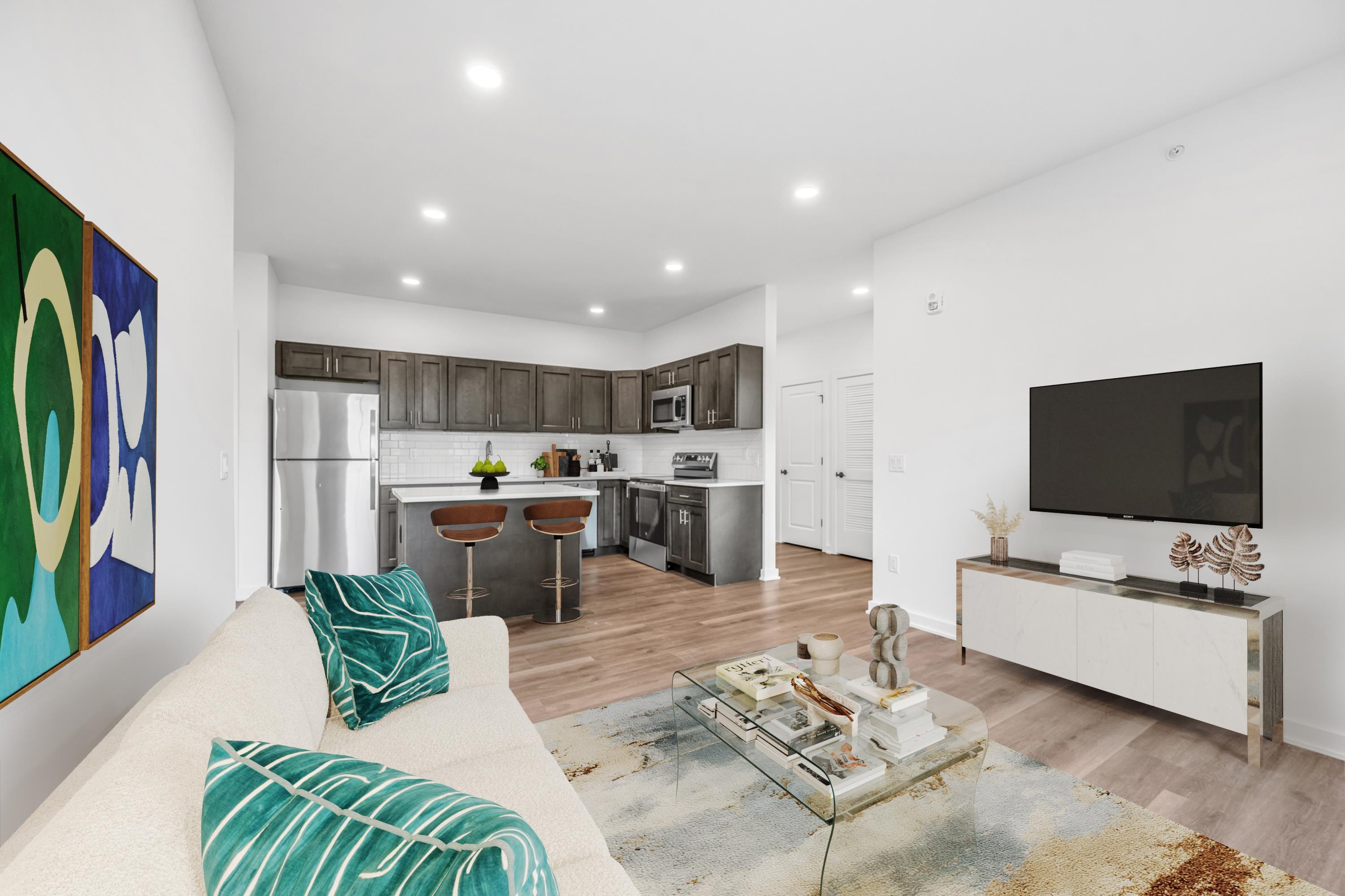 315 Railroad Avenue, Unit 204 East Rutherford, NJ 07073 - Photo 29 of 29 a living room with furniture and a flat screen tv