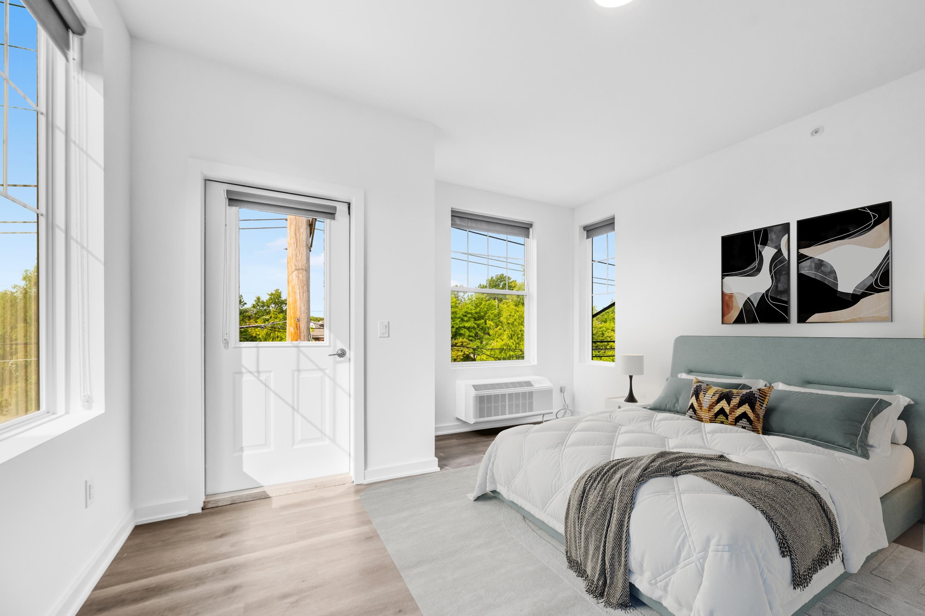 315 Railroad Avenue, Unit 204 East Rutherford, NJ 07073 - Photo 9 of 29 a spacious bedroom with a bed and a window