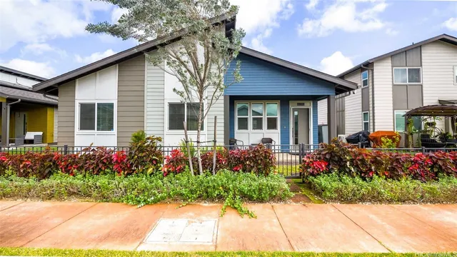 a aerial view of a house with a yard
