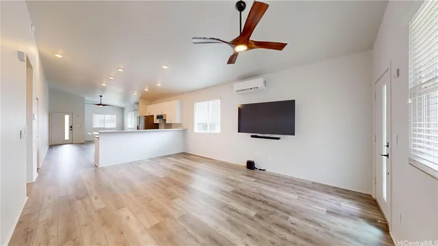 a view of a livingroom with a kitchen