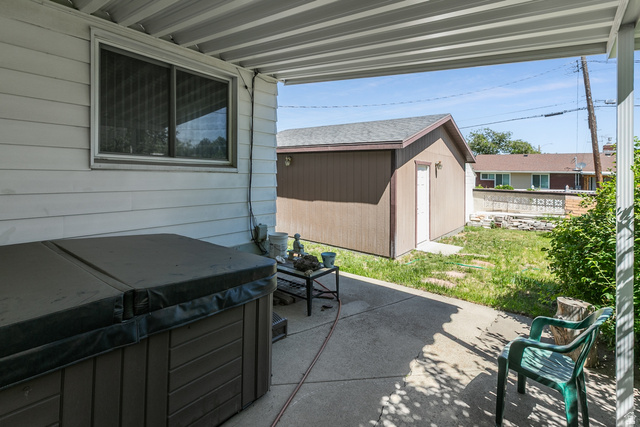 59 East Pinehurst Street Tooele, UT 84074 - Photo 21 of 22 Covered patio with concrete slab flooring and exterior siding