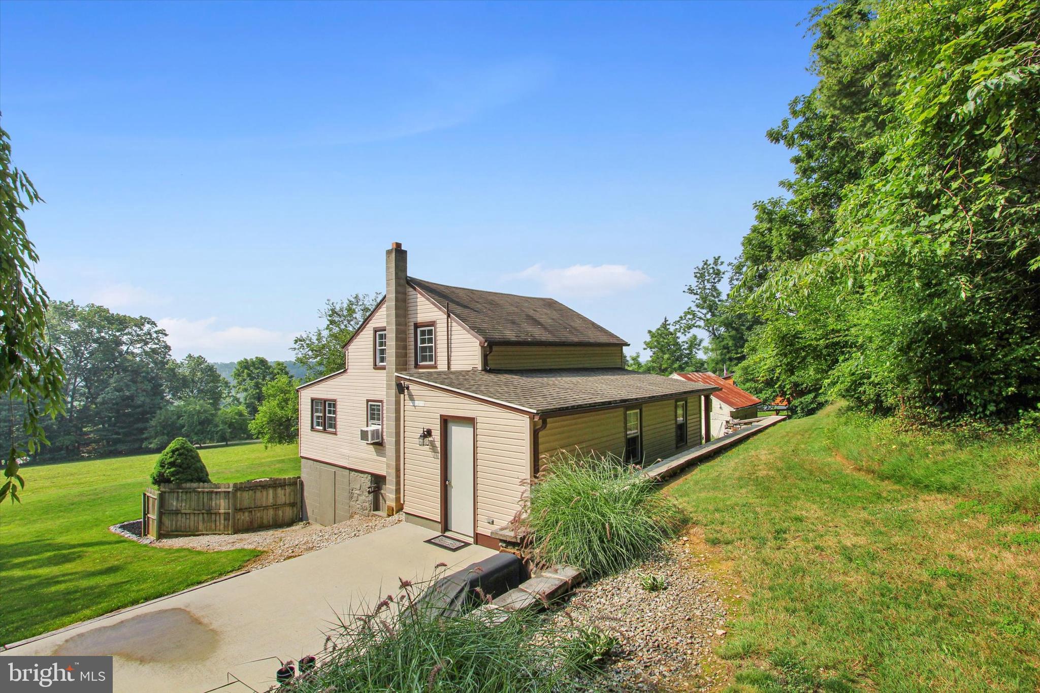 184 Three Hill Road Spring Grove, PA 17362 - Photo 3 of 29 a front view of a house with garden