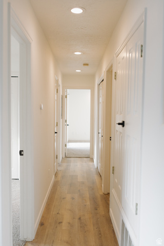 215 South 1050th West, Unit 10 Provo, UT 84601 - Photo 8 of 38 Hallway featuring recessed lighting and light wood-style flooring