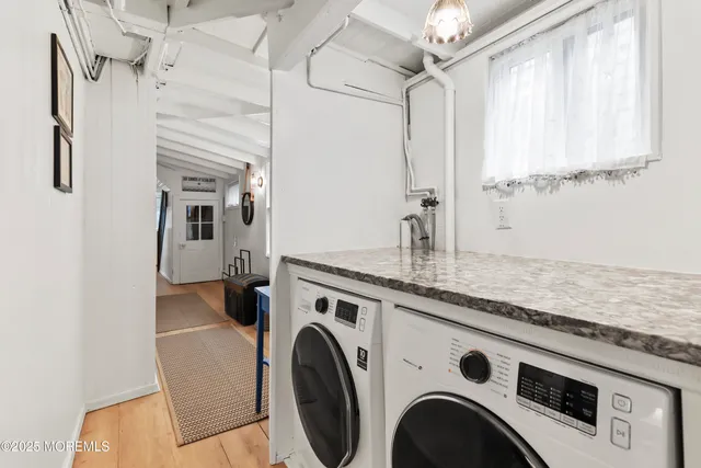a utility room with closet dryer and washer
