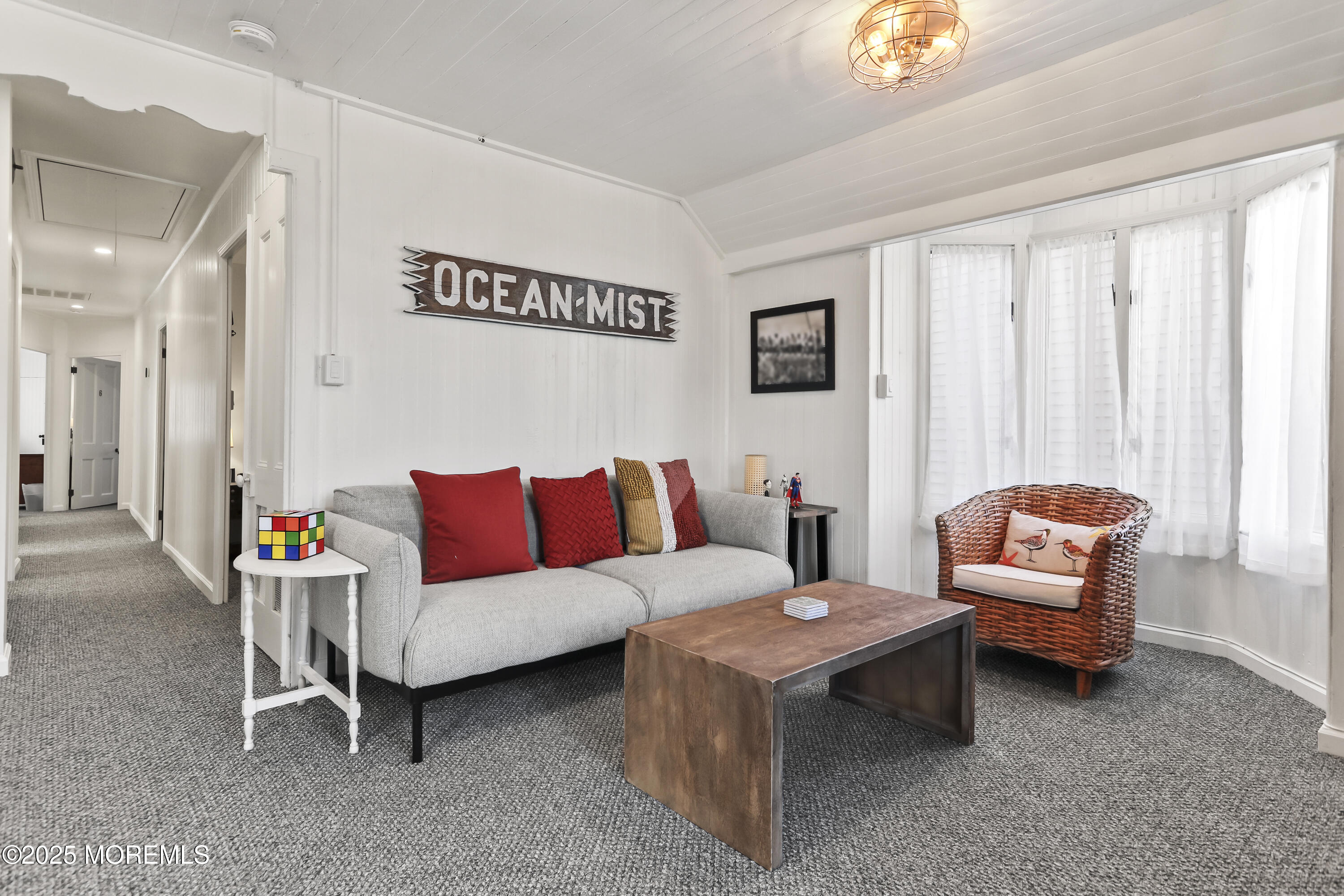 9 Pitman Avenue Ocean Grove, NJ 07756 - Photo 25 of 41 a living room with furniture and a large window