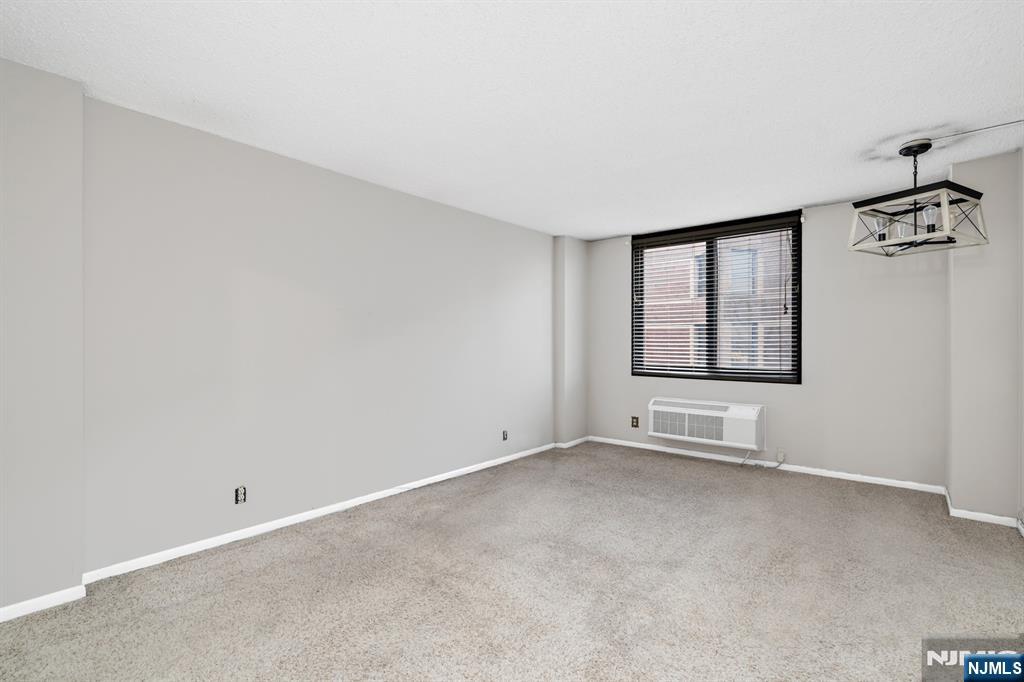 326 Prospect Avenue, Unit 8E Hackensack, NJ 07601 - Photo 11 of 20 an empty room with windows
