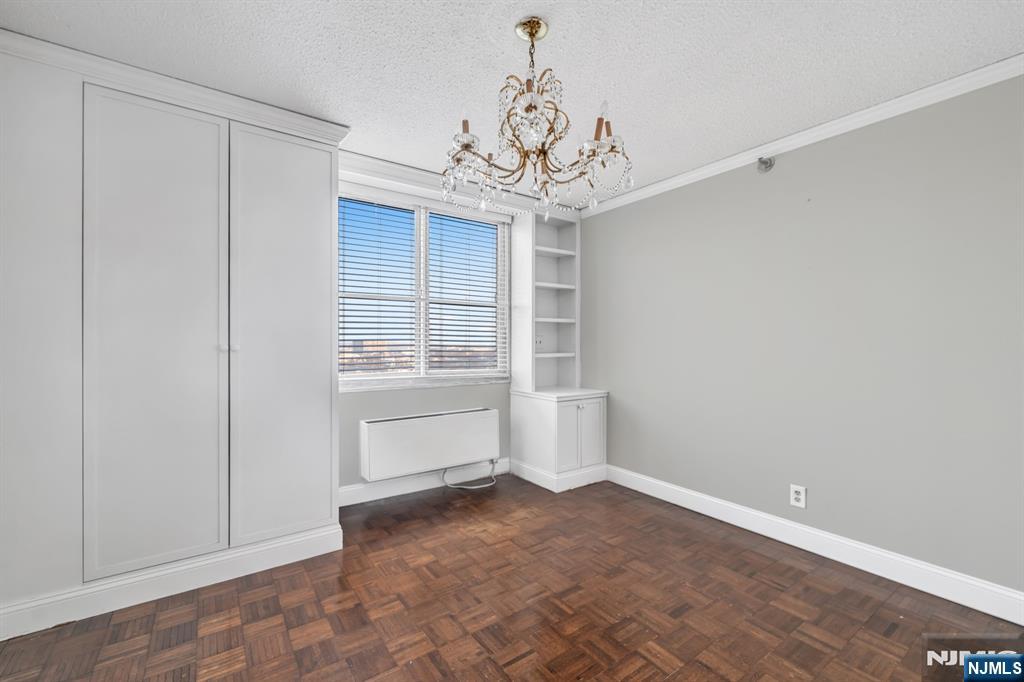 326 Prospect Avenue, Unit 8E Hackensack, NJ 07601 - Photo 17 of 20 a view of an empty room with a window