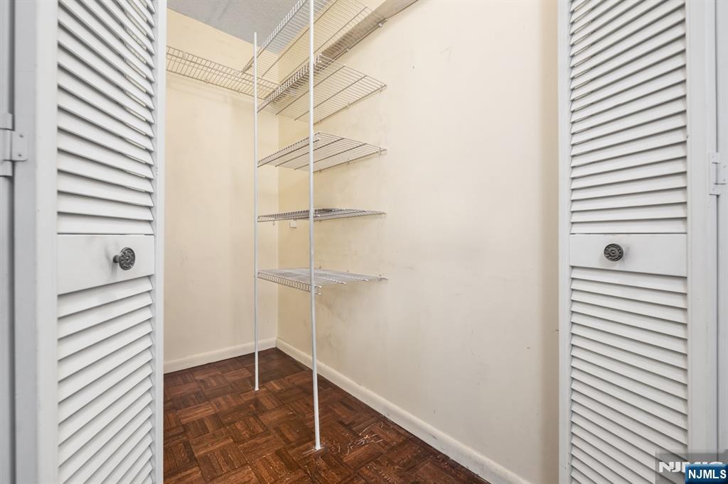 326 Prospect Avenue, Unit 8E Hackensack, NJ 07601 - Photo 19 of 20 a view of a room with shelf