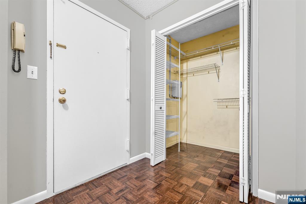 326 Prospect Avenue, Unit 8E Hackensack, NJ 07601 - Photo 20 of 20 a view of a bathroom with a glass door