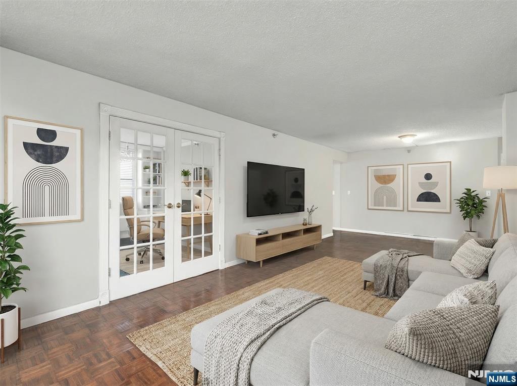 326 Prospect Avenue, Unit 8E Hackensack, NJ 07601 - Photo 5 of 20 a bedroom with a bed and a flat screen tv