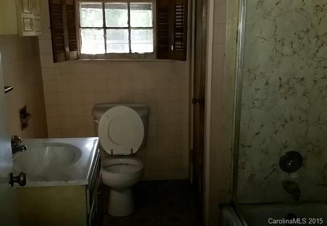 4102 South New Hope Road Gastonia, NC 28056 - Photo 7 of 10 a bathroom with a toilet and a sink