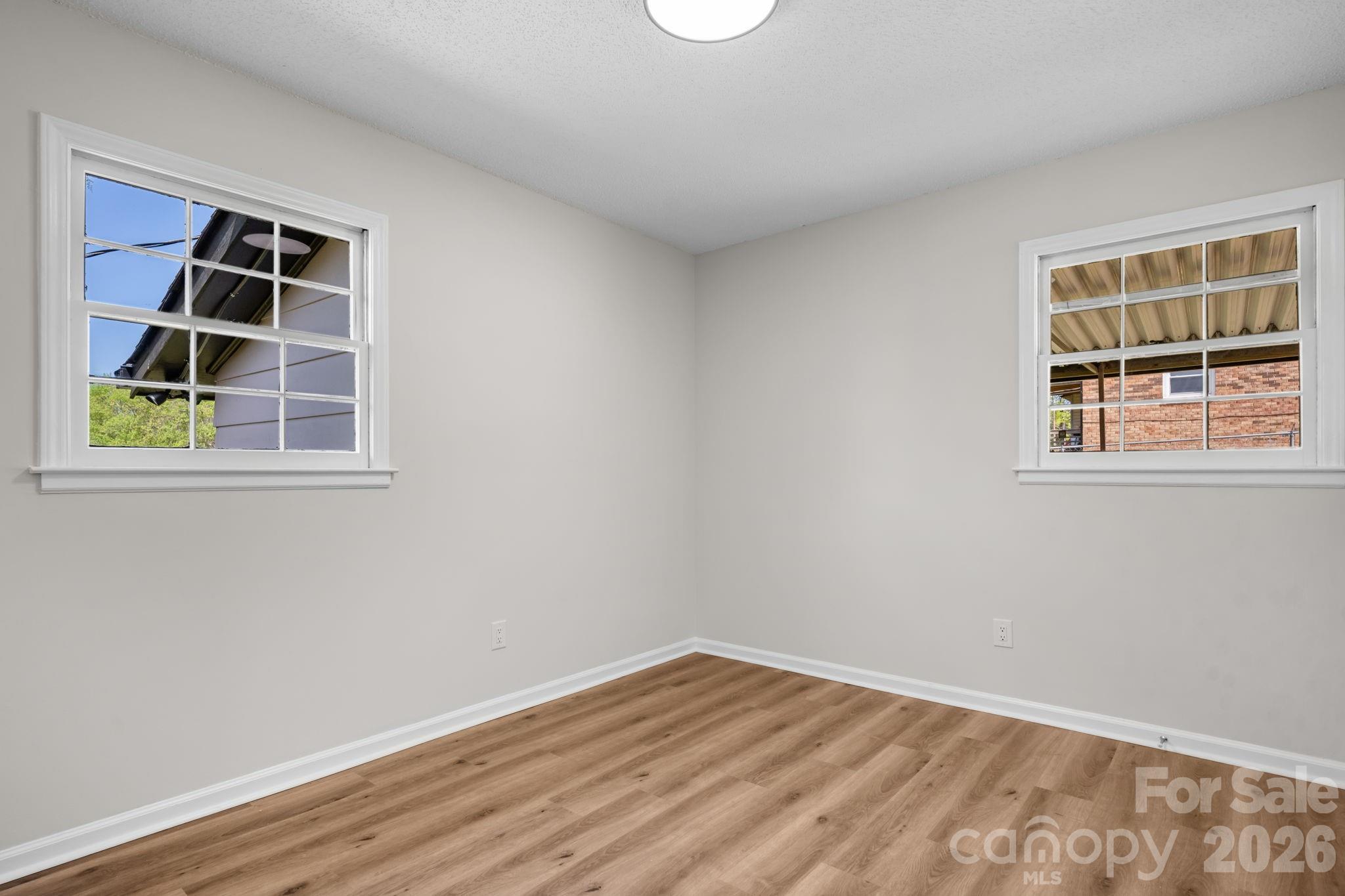 1307 6th Avenue Northwest Conover, NC 28613 - Photo 13 of 17 a view of empty room with windows and entryway