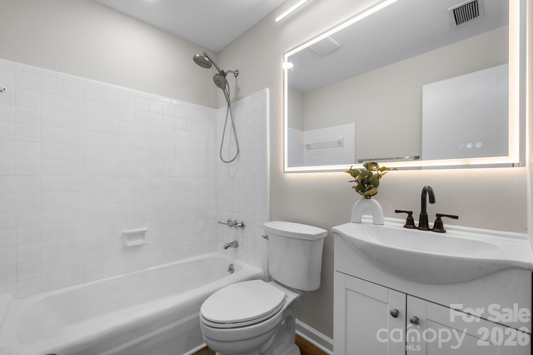 1307 6th Avenue Northwest Conover, NC 28613 - Photo 15 of 17 a bathroom with a sink toilet and shower