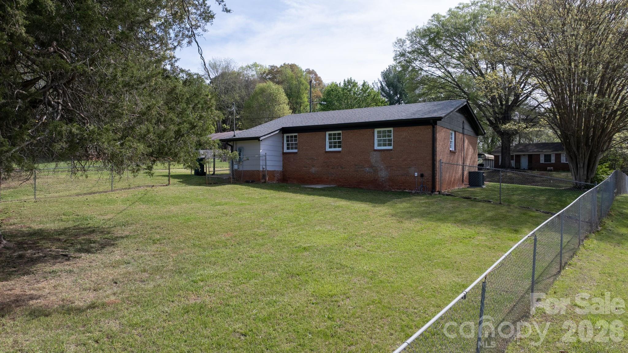 1307 6th Avenue Northwest Conover, NC 28613 - Photo 16 of 17 a view of a house with a yard
