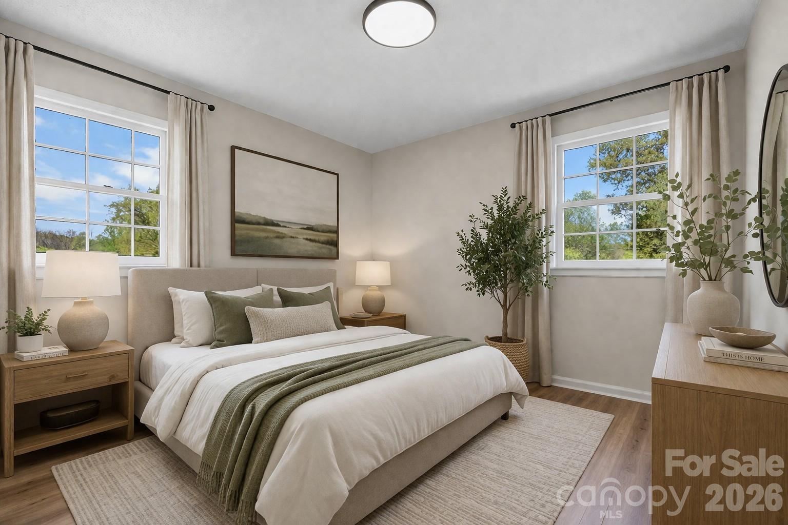 1307 6th Avenue Northwest Conover, NC 28613 - Photo 10 of 17 a bedroom with a large bed and a potted plant