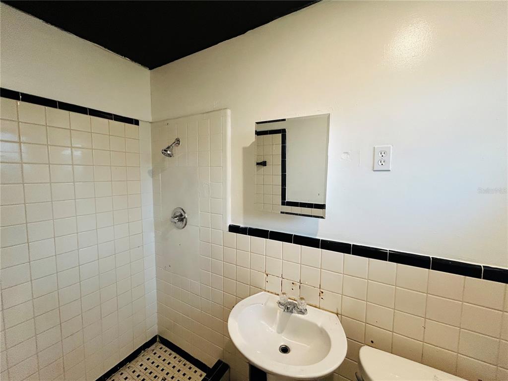 8010 Southeast Us Highway Hawthorne, FL 32640 - Photo 21 of 22 a bathroom with a sink a toilet and shower