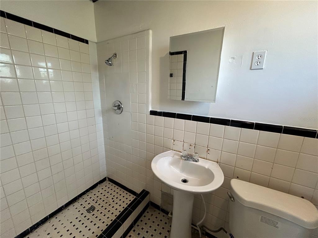 8010 Southeast Us Highway Hawthorne, FL 32640 - Photo 22 of 22 a bathroom with a sink a toilet and a mirror