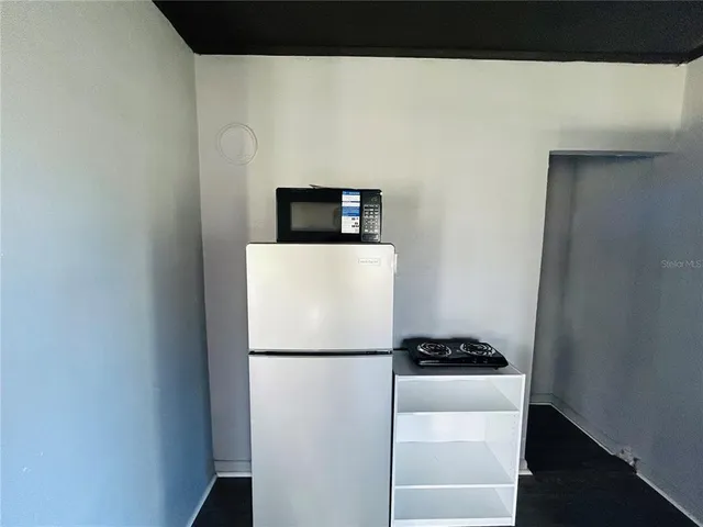 a refrigerator freezer sitting in a kitchen