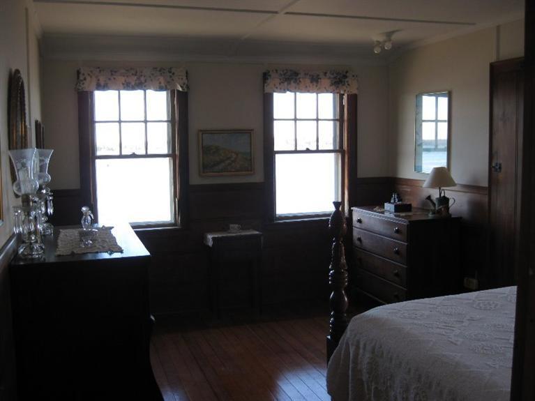 41 Benedict Road Bourne, MA 02532 - Photo 15 of 22 a bedroom with a bed and a window