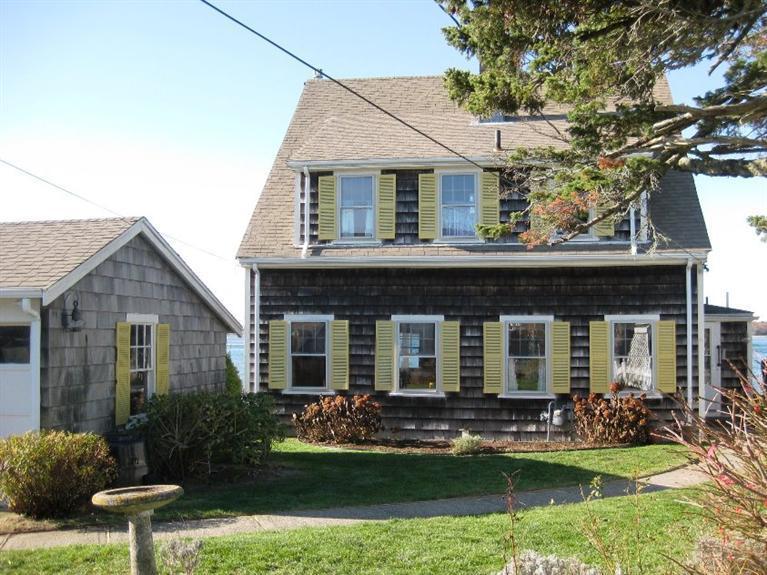 41 Benedict Road Bourne, MA 02532 - Photo 3 of 22 a front view of a house with garden and porch