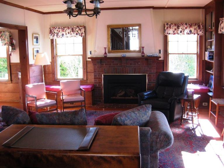 41 Benedict Road Bourne, MA 02532 - Photo 9 of 22 a living room with furniture and a fireplace
