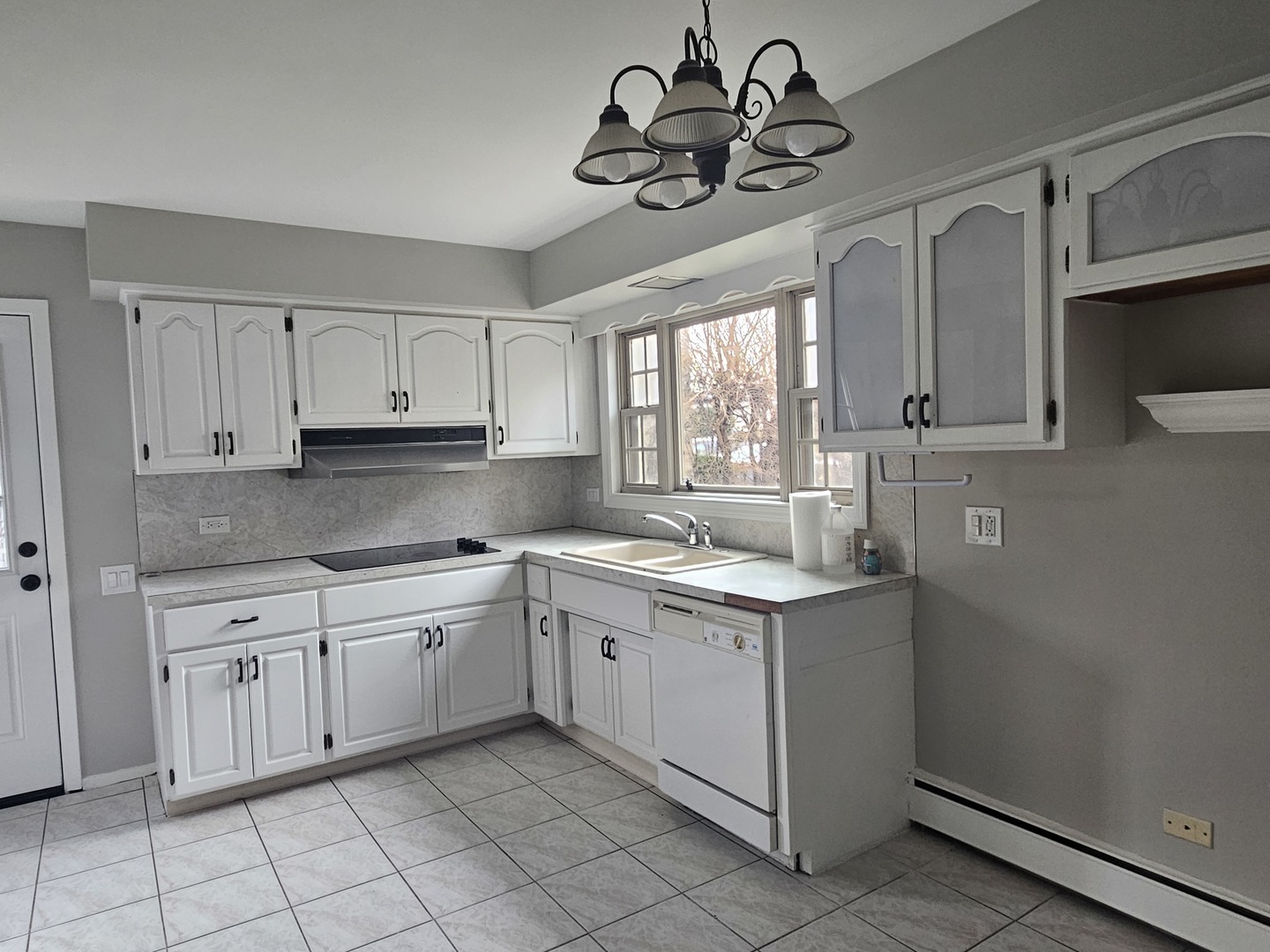 863 North Northwest Highway, Unit 1 Park Ridge, IL 60068 - Photo 13 of 21 a kitchen with a sink cabinets and window