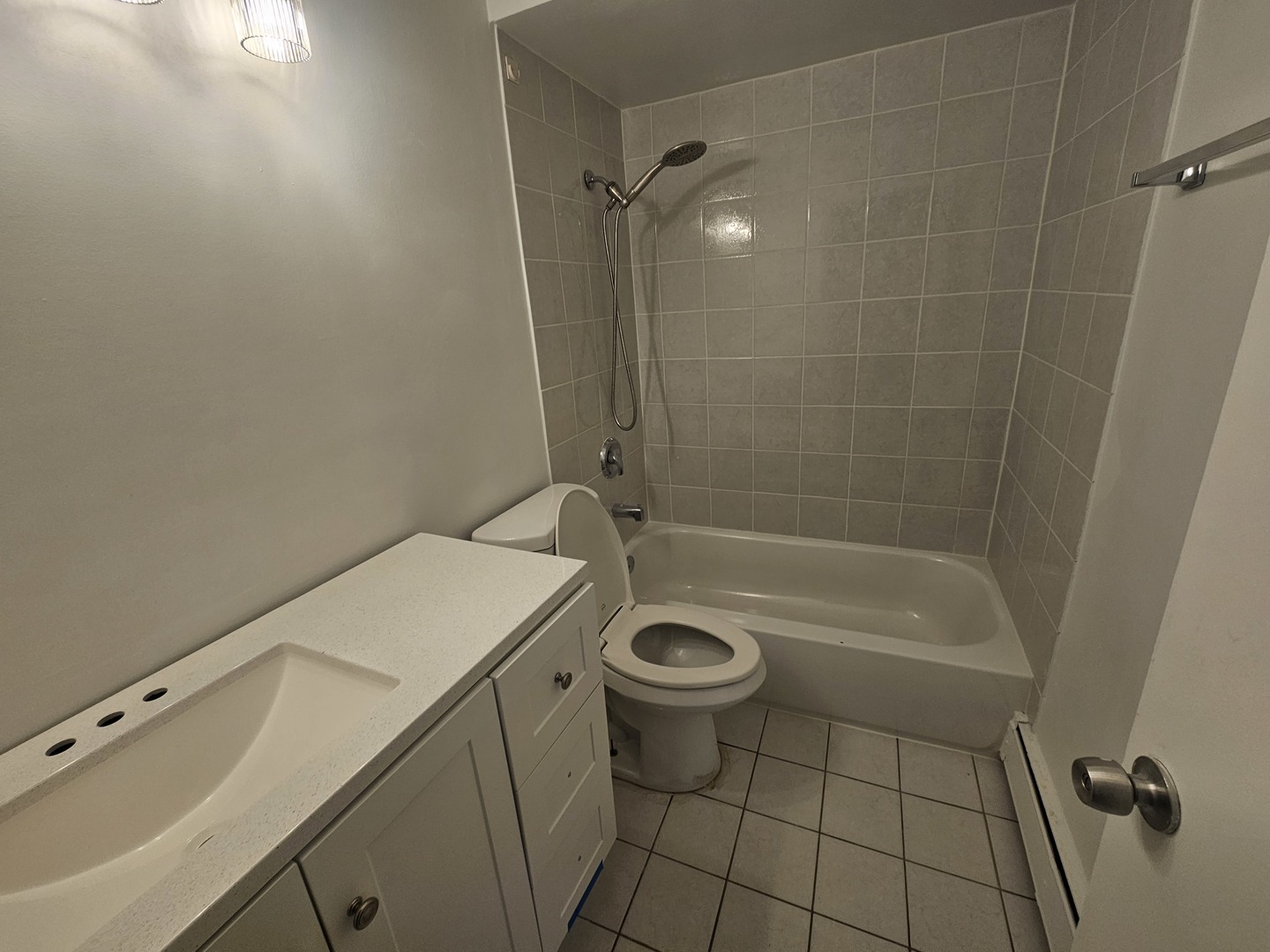 863 North Northwest Highway, Unit 1 Park Ridge, IL 60068 - Photo 14 of 21 a bathroom with a sink a toilet and shower