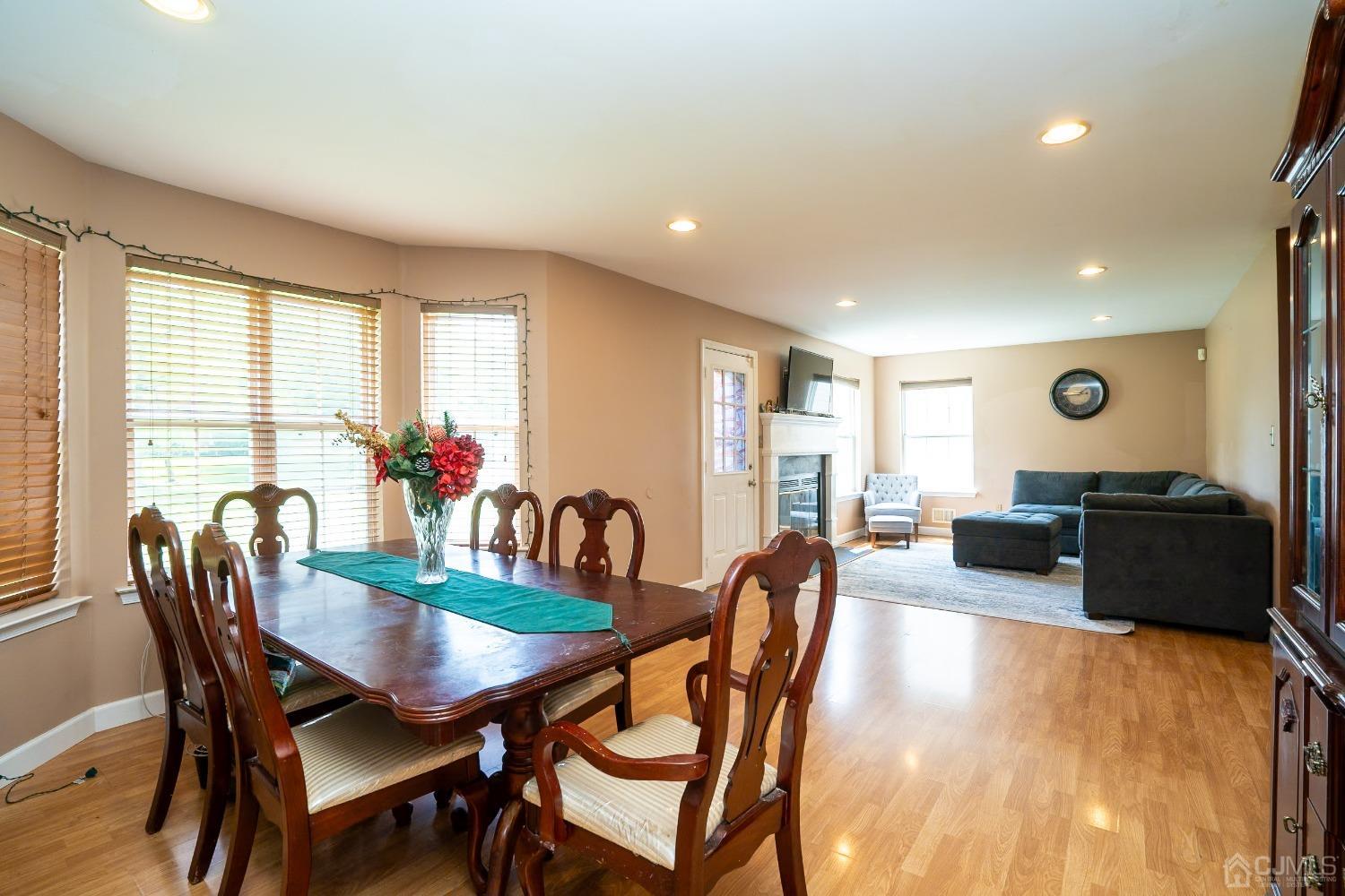 63 Springfield Road North Brunswick, NJ 08902 - Photo 12 of 42 a view of a dining room with furniture and wooden floor