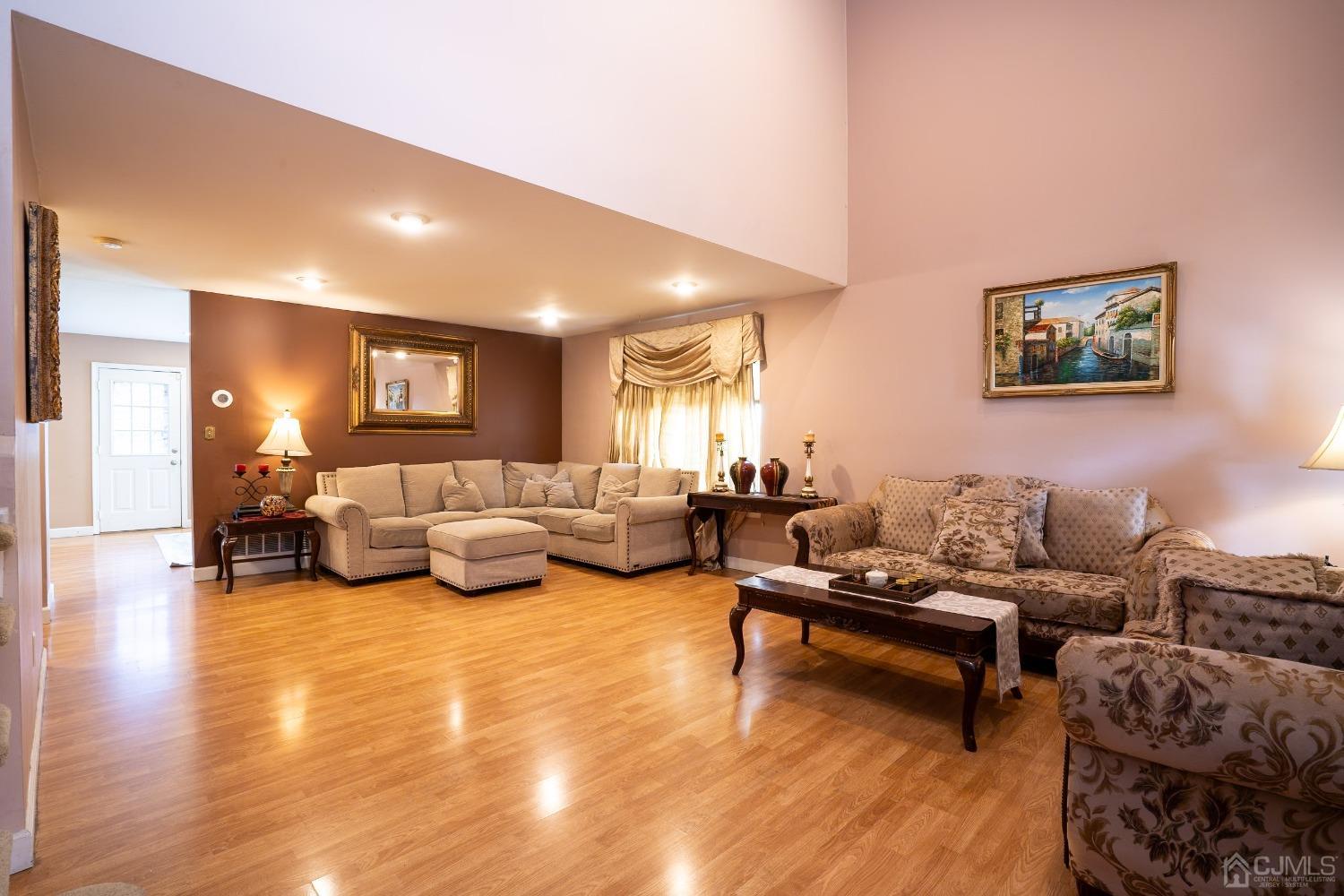 63 Springfield Road North Brunswick, NJ 08902 - Photo 4 of 42 a living room with furniture and wooden floor