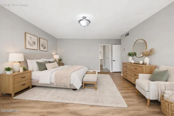 a bed room with a bed and a couch