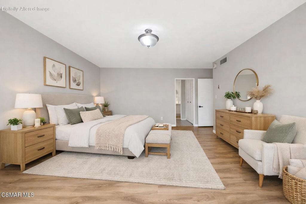 12955 Riverside Drive, Unit 307 Sherman Oaks, CA 91423 - Photo 12 of 24 a bed room with a bed and a couch