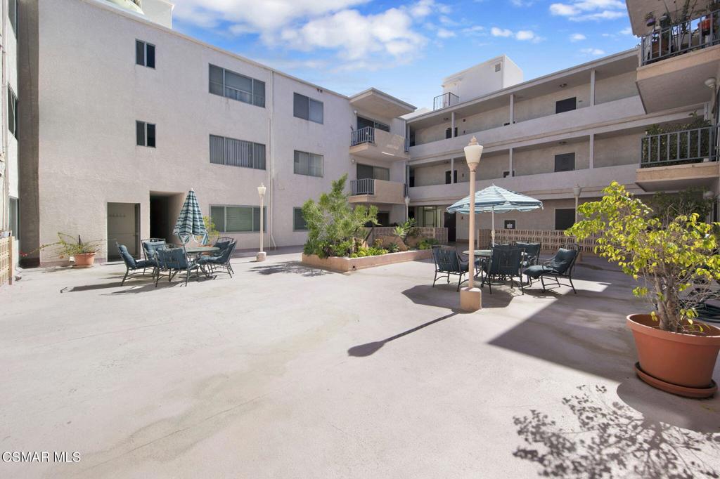 12955 Riverside Drive, Unit 307 Sherman Oaks, CA 91423 - Photo 21 of 24 a view of a building with sitting area