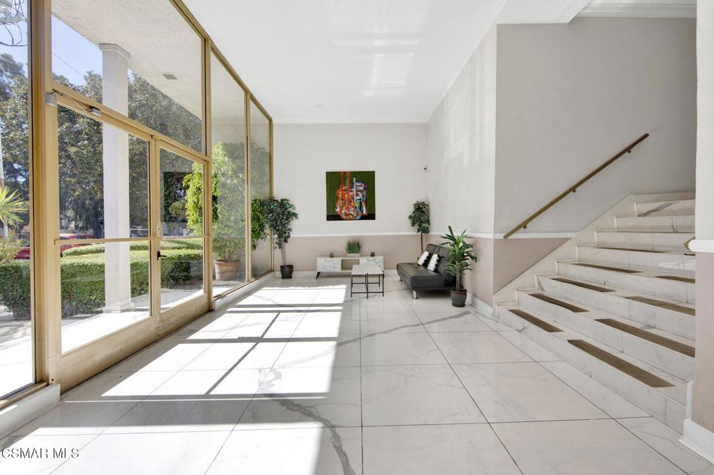 12955 Riverside Drive, Unit 307 Sherman Oaks, CA 91423 - Photo 23 of 24 a view of staircase with a rug and a rug
