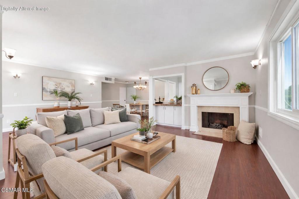 12955 Riverside Drive, Unit 307 Sherman Oaks, CA 91423 - Photo 4 of 24 a living room with furniture a fireplace and a large window