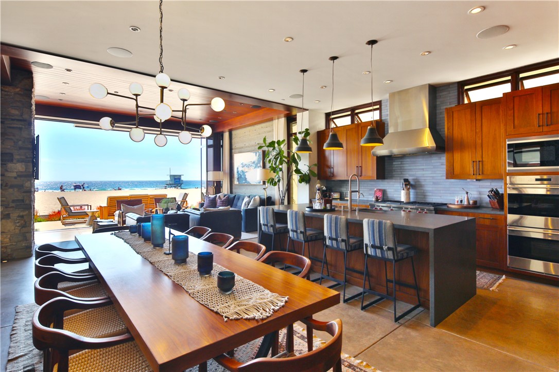 a kitchen with stainless steel appliances granite countertop a stove and refrigerator