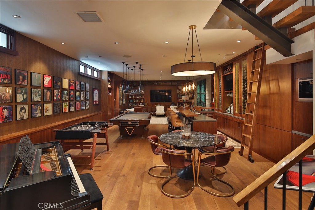 3124 The Strand Hermosa Beach, CA 90254 - Photo 11 of 28 a living room with furniture a window and gym equipment