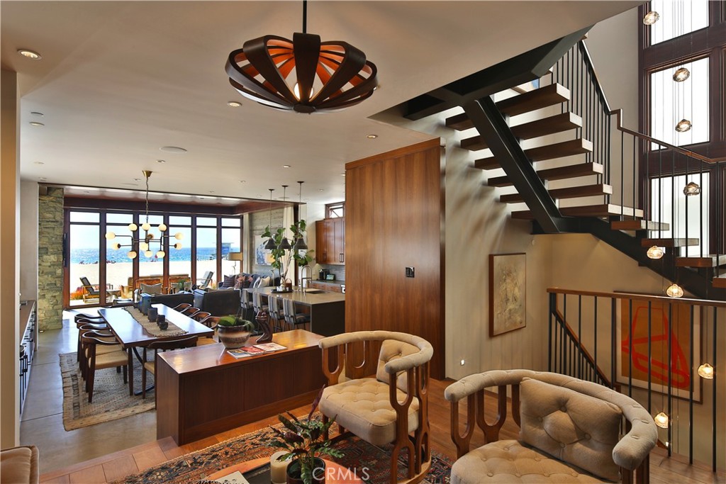 3124 The Strand Hermosa Beach, CA 90254 - Photo 9 of 28 a living room with furniture a chandelier and a large window