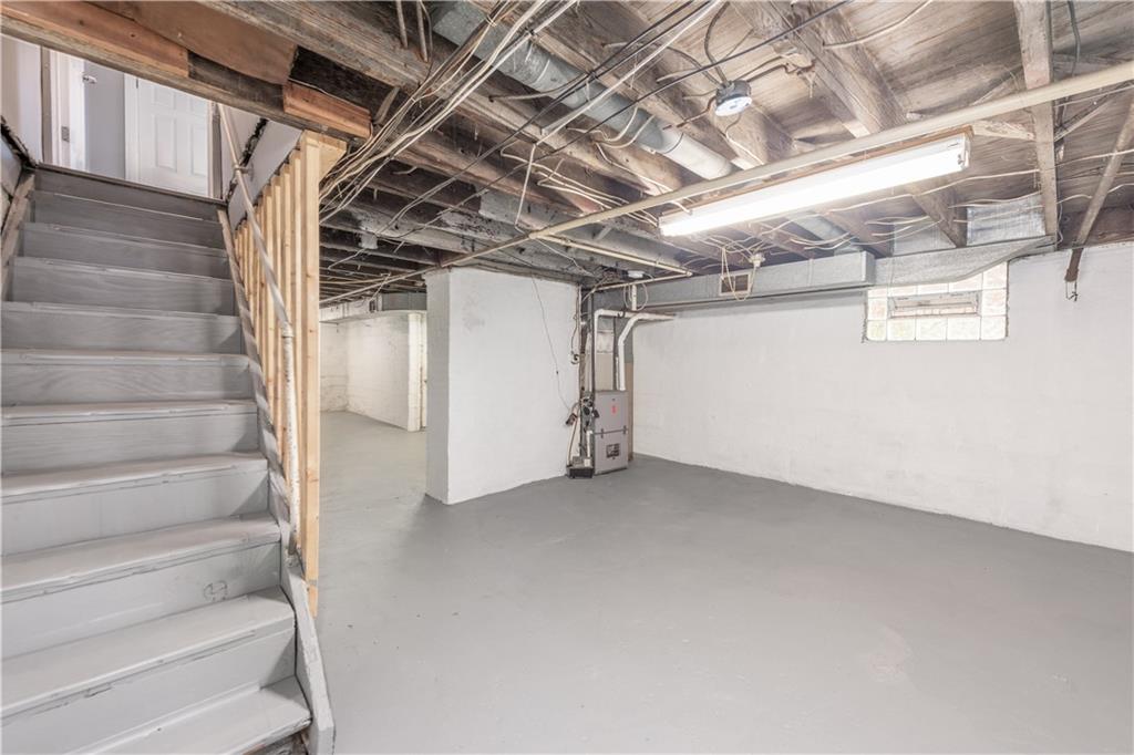 10013 Frankstown Road Pittsburgh, PA 15235 - Photo 23 of 25 This area can be used as a "game room area" with room. Spacious, clean and "ready to be" the homeowners new project...what will your decision be for this room?