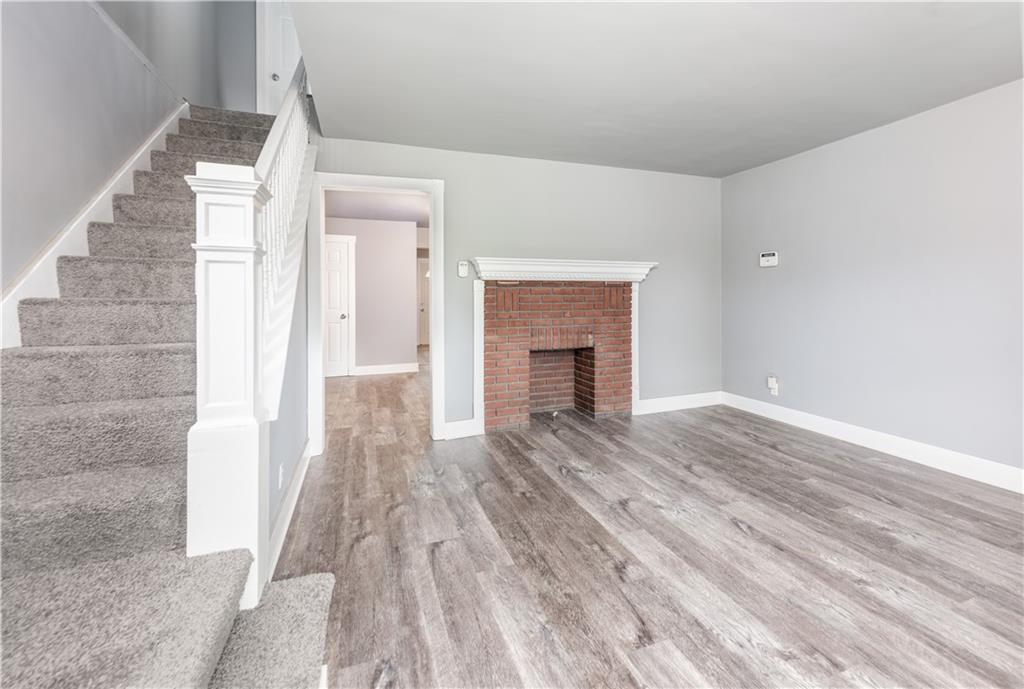 10013 Frankstown Road Pittsburgh, PA 15235 - Photo 3 of 25 Enjoy this Freshly painted living room of 13' x 13' with the latest Pottery Barn colors. New premier plank flooring and plus gray carpeting up the steps to the second and third level. The fireplace is decorative.