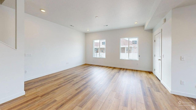 783 Pheasantbrook Drive, Unit 2A Centerville, UT 84014 - Photo 4 of 41 Spacious interior featuring wood-finish flooring, white walls, recessed lighting, and bright windows