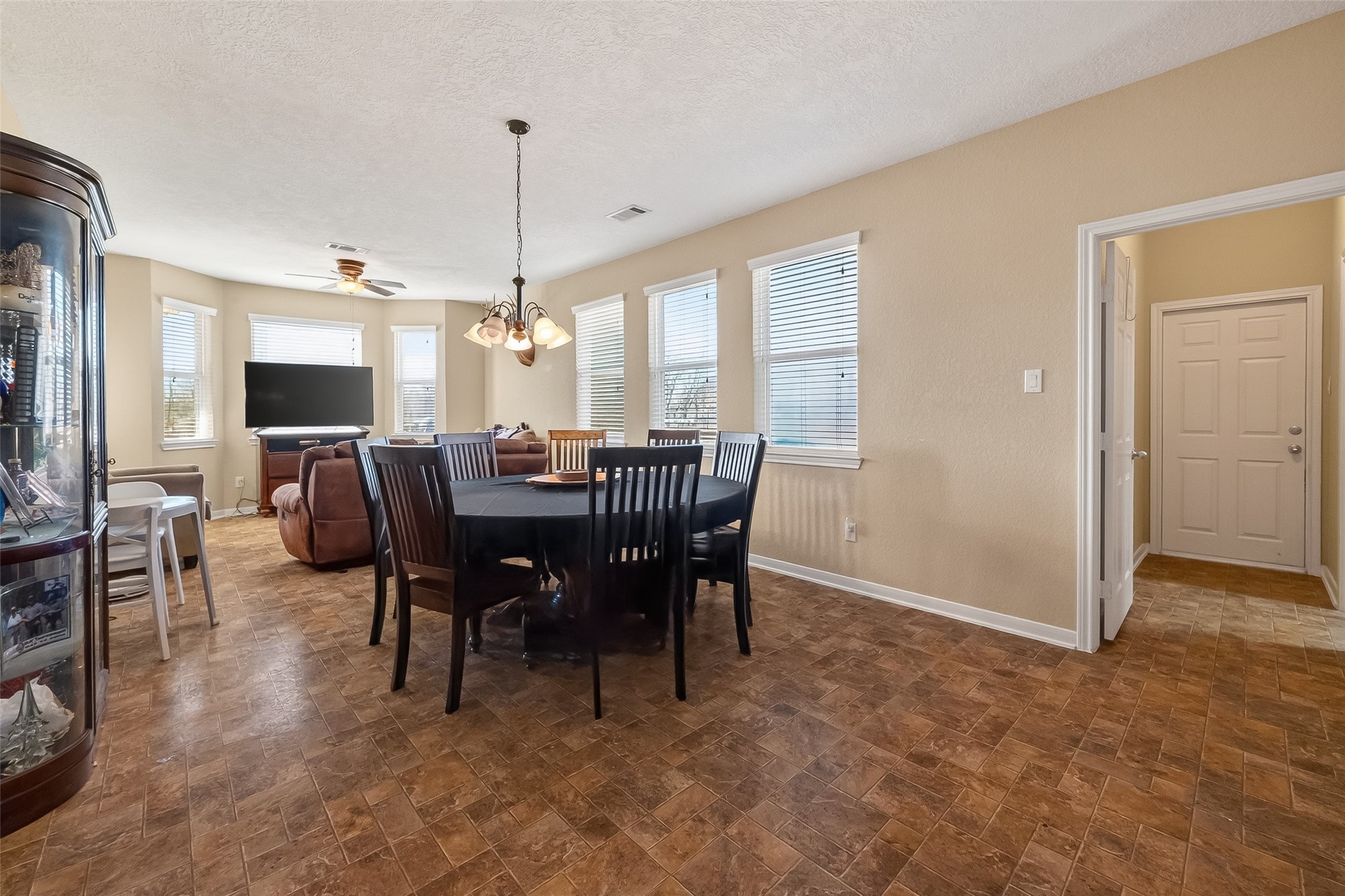 3418 Barbers Hill Road Highlands, TX 77562 - Photo 12 of 50 a view of a dining room with furniture window and wooden floor