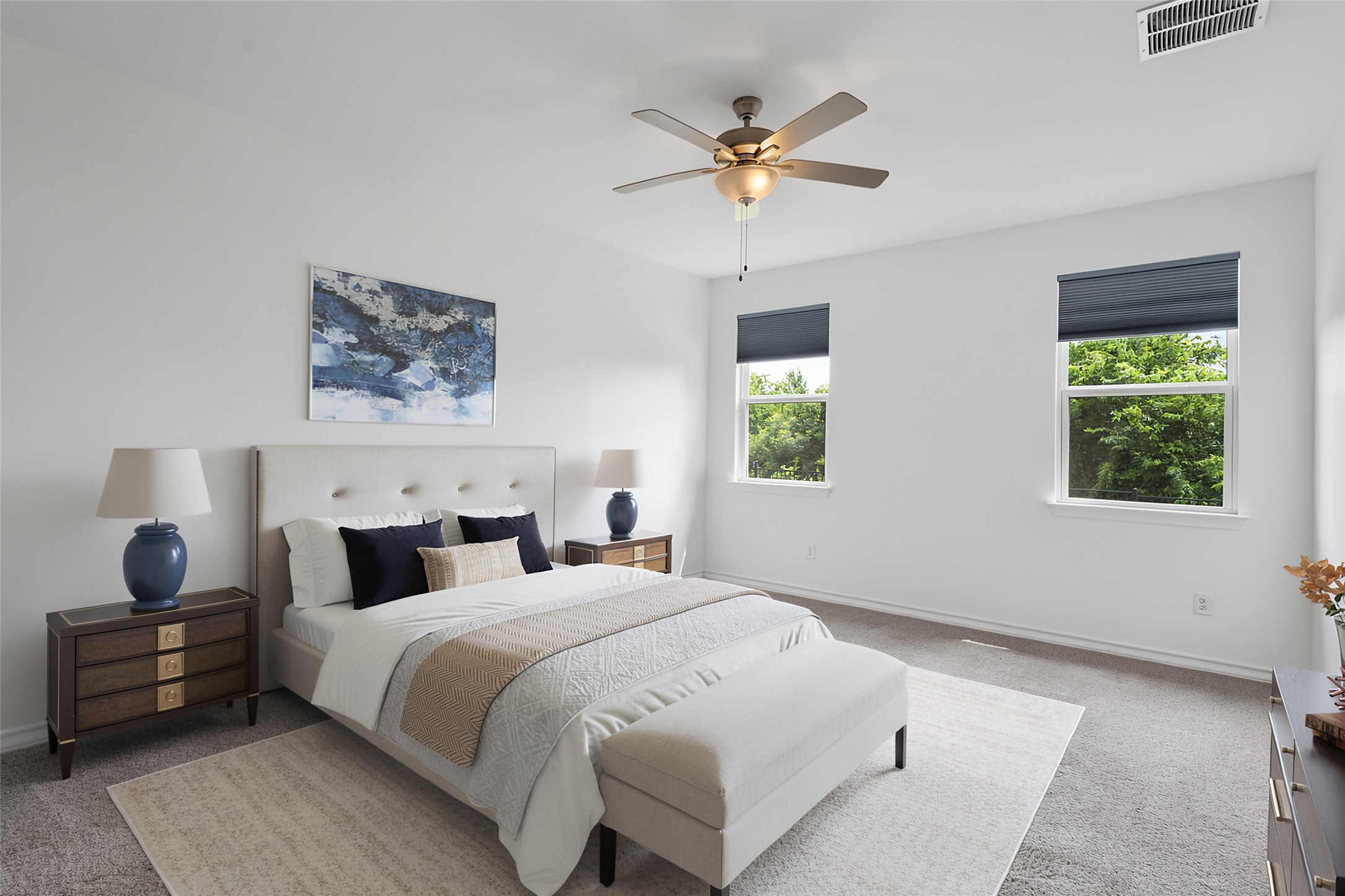 104 Stinchcomb Road Hutto, TX 78634 - Photo 15 of 40
The private primary suite offers more greenbelt views, an en suite bath with dual vanities, a walk-in shower, and a spacious walk-in closet.