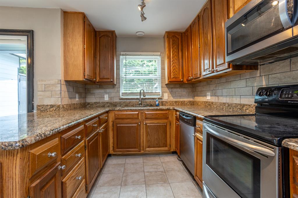 1206 Oakbluff Drive Lancaster, TX 75146 - Photo 7 of 23 Cabinets have lots of drawer space and new hardware.