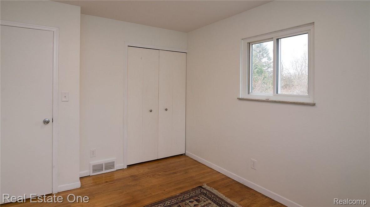 2655 Porter Road White Lake, MI 48383 - Photo 23 of 39 Bedroom 3 with hardwood floors.